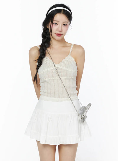 LEWKIN Romantic Lace Cami Top IU525 Light beige S/M front model shot with braided hair, lace V-neck trim, pointelle knit, styled with white mini skirt and silver bag