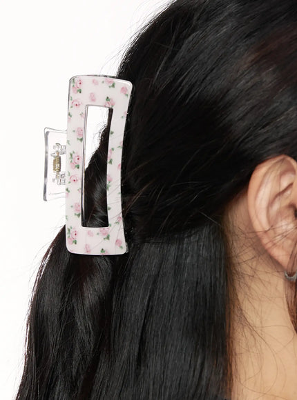 Rose Square Hair Pin IL514 pink floral close-up worn shot clipping dark hair at side showing rectangular frame with ditsy rose pattern