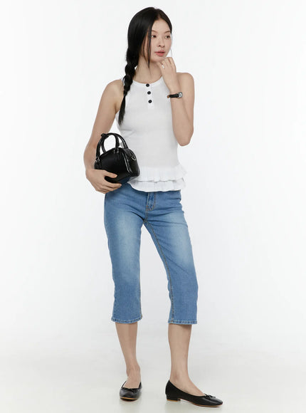 Roselle Capri Jorts IL506 Blue full-body front styling shot on model wearing white ruffle tank top holding black mini bag with watch