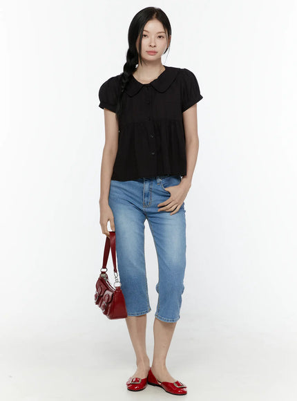 Roselle Capri Jorts IL506 Blue full-body front styling shot on model wearing black short-sleeve collared blouse carrying red shoulder bag