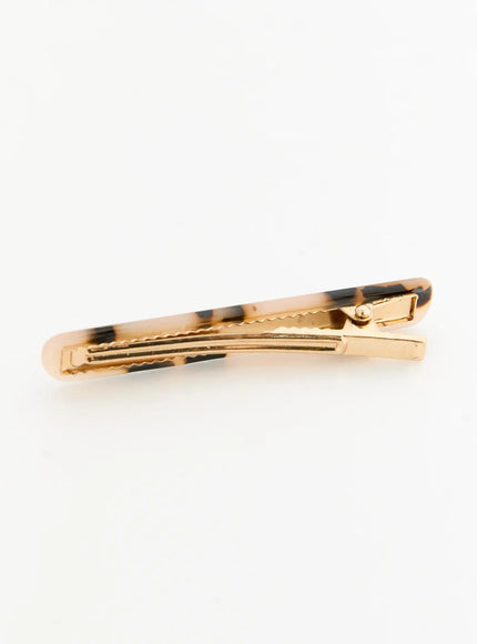Rosie One Hair Clip IL503 Tortoise back view flat-lay showing closed gold-tone metal clip interior with serrated teeth and spring hinge