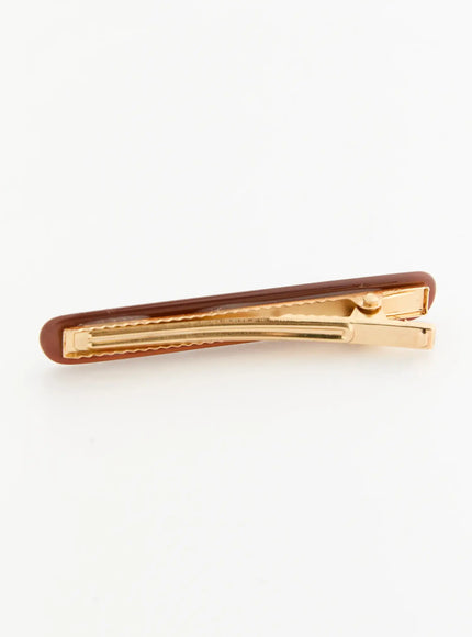 Rosie One Hair Clip IL503 Brown back view flat-lay showing closed gold-tone metal clip interior with serrated teeth and spring hinge