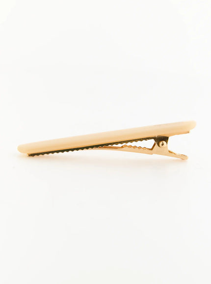 Rosie One Hair Clip IL503 Ivory side view showing open alligator clip, cream resin top with gold-tone serrated metal jaw detail