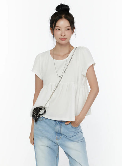 LEWKIN Round Neck Shirred Short Sleeve Top CL520 White front shot on model wearing bun updo styled with light blue wide-leg jeans and black chain crossbody bag