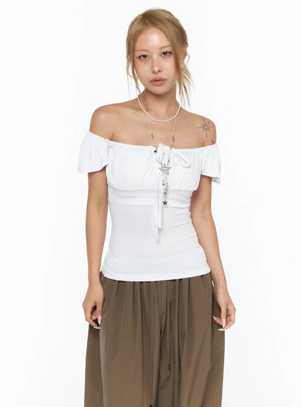 Ruched Off-Shoulder Bow Detail Top CU524 white front shot on model wearing off-shoulder style with ruched bust and center tie ribbon detail