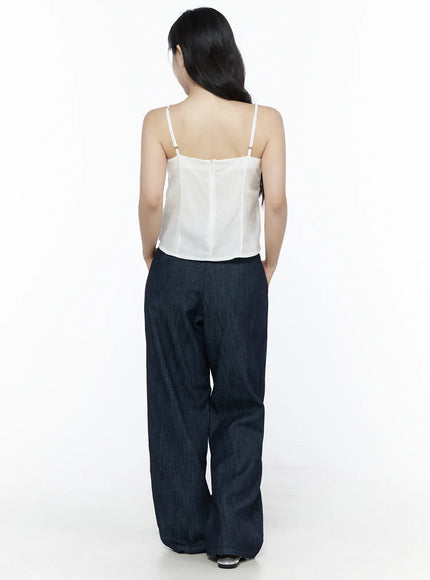Ruched Ribbon Cami Top IU525 White full-length back shot on model showing adjustable straps with metal buckles smooth back panel and wide-leg dark denim