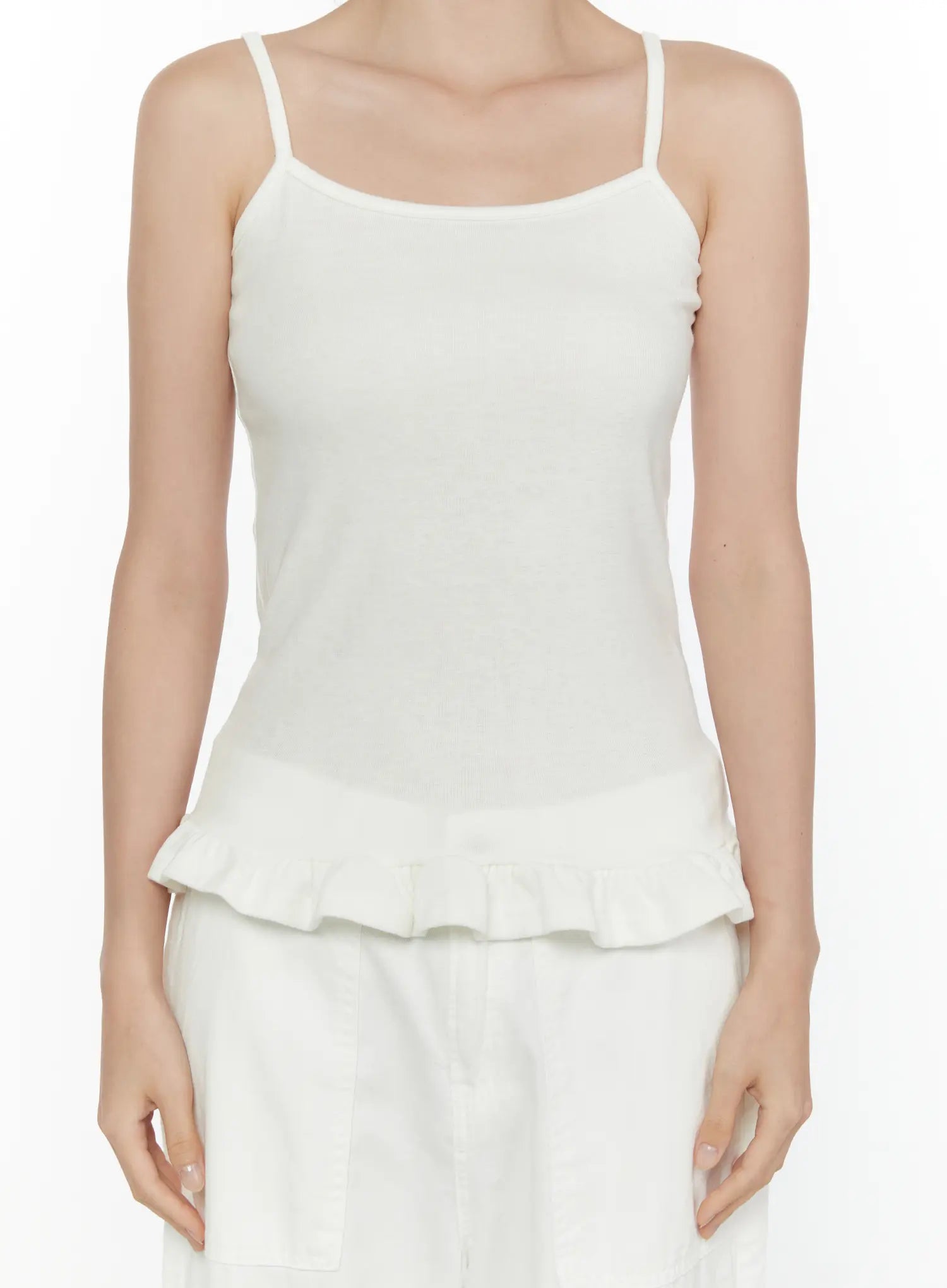 Ruffle Detail Cami Top CL521 White close-up front shot on model, spaghetti straps, square neckline, ribbed texture detail, fitted bodice with ruffle hem, no accessories