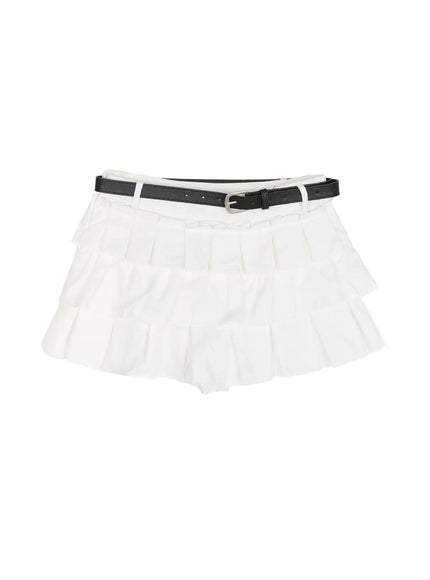 Ruffle Detail Mini Skirt IL523 White flat-lay showing full three-tier pleated ruffle structure with black leather belt and silver buckle on white background
