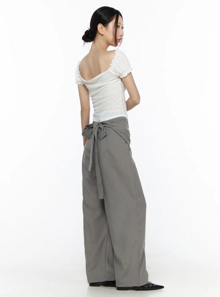 Ruffle Detailed Blouse CL527 White back three-quarter model shot showing open scoop back neckline with ruffle trim and textured fabric detail