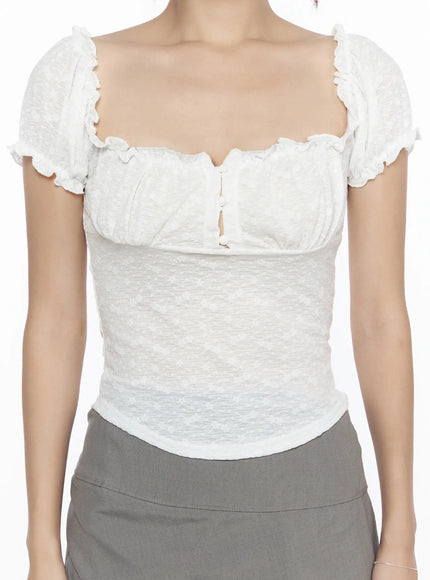 Ruffle Detailed Blouse CL527 White close-up front detail shot on model showing scalloped sweetheart neckline, center hook closure, and jacquard texture