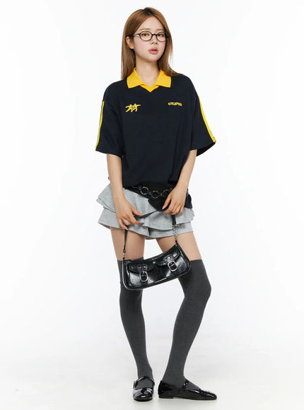 LEWKIN Ruffle Hem Mini Skort CL502 Gray S full-body front model shot styled with navy polo top dark knee-high socks and black patent flats