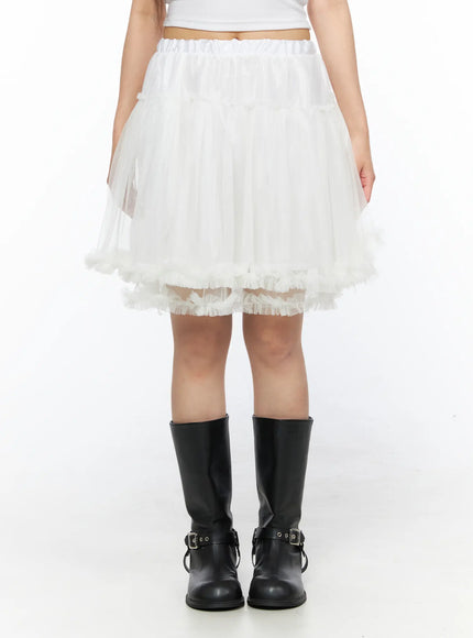 Ruffle Layered Midi Skirt CL517 White front shot on model showing elastic waistband tiered tulle layers and frayed ruffle hem with black boots