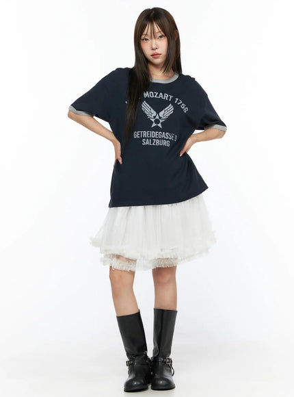 Ruffle Layered Midi Skirt CL517 White full-body front shot on model styled with navy Mozart graphic tee and black knee-high boots hands on hips