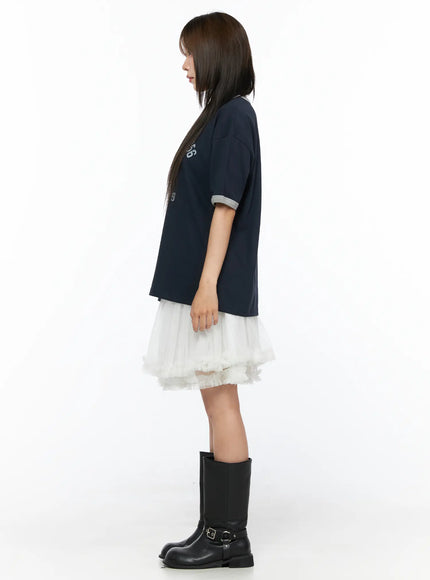 Ruffle Layered Midi Skirt CL517 White side profile full-body shot on model styled with navy oversized tee and black boots showing skirt length and volume