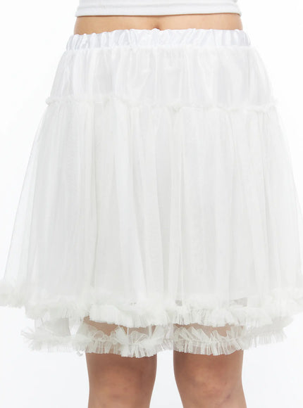 Ruffle Layered Midi Skirt CL517 White close-up front shot on model showing satin elastic waistband sheer tulle layers and layered frilly ruffle hem detail