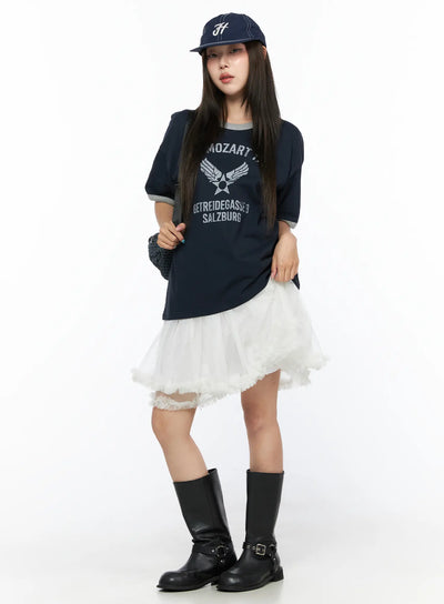 LEWKIN Ruffle Layered Midi Skirt CL517 White S/M full-body lifestyle shot on model styled with navy graphic tee cap and black knee-high boots