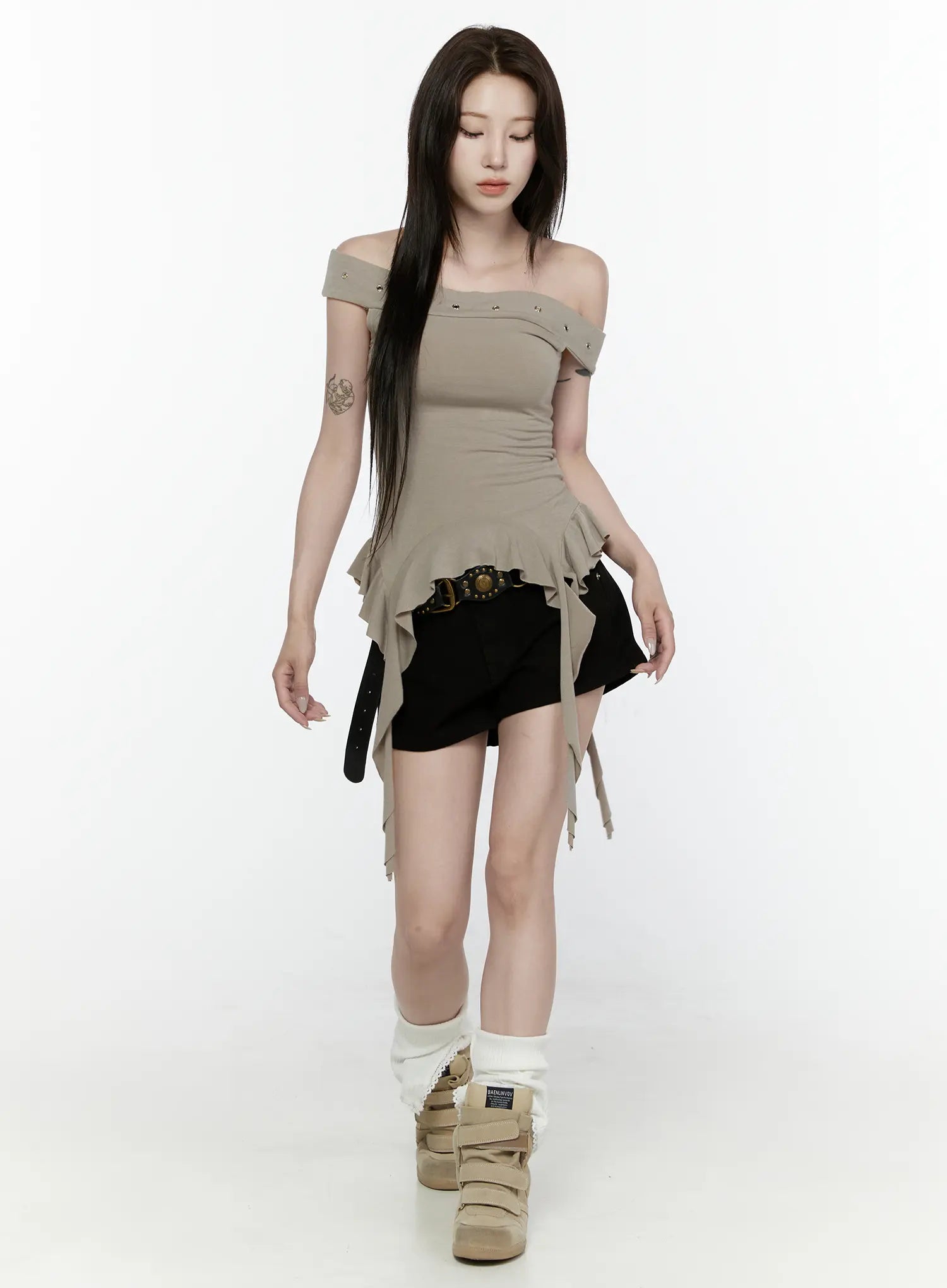 Ruffle Off-Shoulder Top IL521 Dark green full-body walking model shot eyes downcast asymmetric ruffle hem ribbon ties belted black shorts sneakers