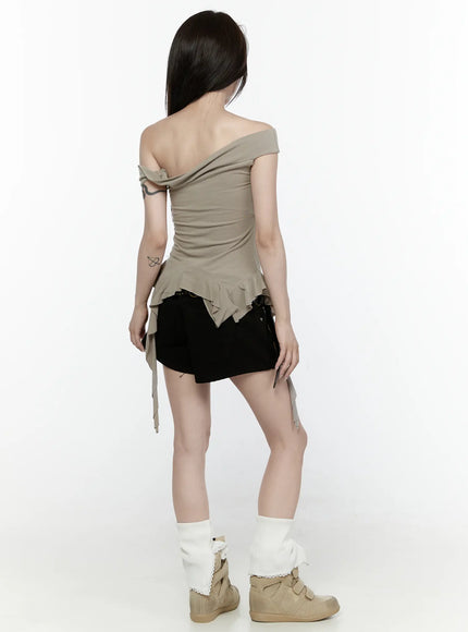 Ruffle Off-Shoulder Top IL521 Dark green back model shot standing showing exposed back off-shoulder silhouette asymmetric ruffle hem ribbon tie details