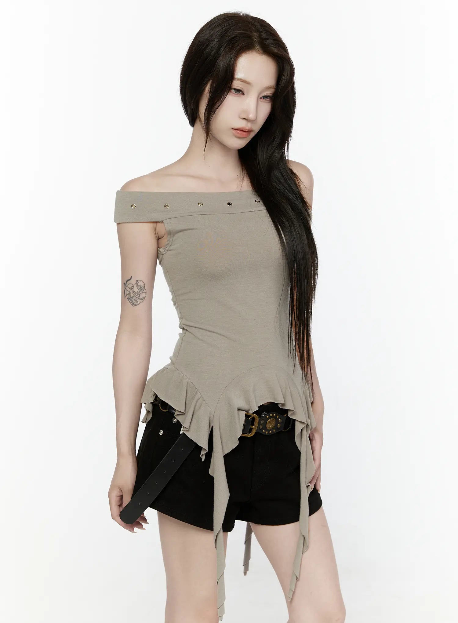 Ruffle Off-Shoulder Top IL521 Dark green front model shot gazing down holding belt ruffle peplum hem ribbon ties gold eyelet off-shoulder neckline