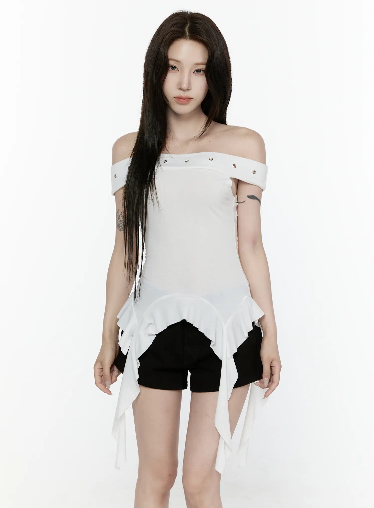 Ruffle Off-Shoulder Top IL521 White front model shot standing neutral pose off-shoulder neckline silver eyelet detail ruffle asymmetric hem ribbon ties