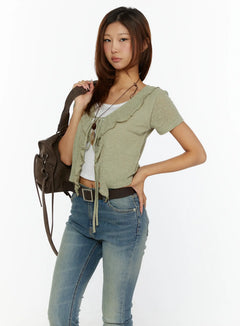 LEWKIN Ruffle Tie Cardigan CL515 Dark green S/M front shot on model styled with jeans and brown shoulder bag, short-sleeve ruffle tie knit crop top