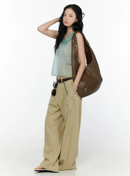 Ruffle V-Neck Sleeveless Top CL521 Mint full-body side shot on model with hand on hair carrying brown studded bag styled with khaki trousers