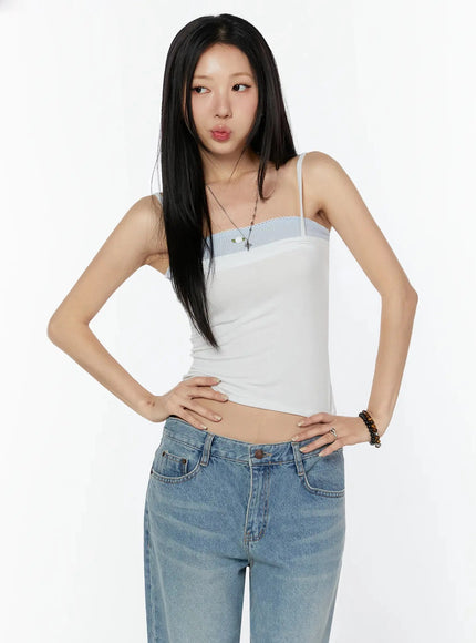 Scallop Trim Layered Cami Top IU524 White S/M three-quarter front model shot hands on hips looking aside showing blue lace-trim band and cropped silhouette