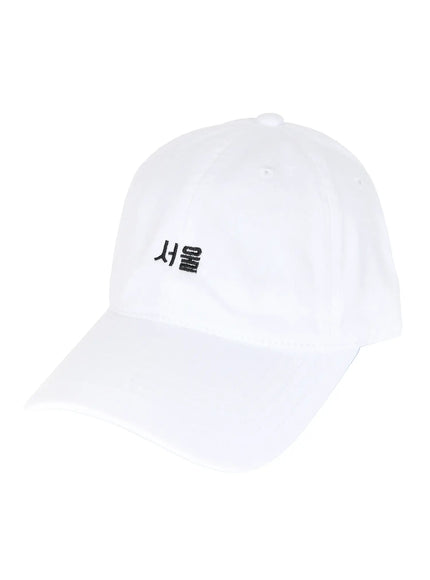 Seoul Mood Cap IL503 White angled side flat product shot on white background, six-panel cotton twill construction, black Seoul Hangul embroidery on front panel