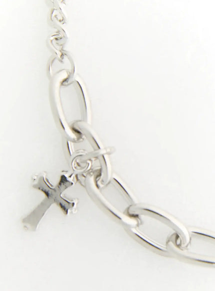 Shadow Sword Necklace IL522 Silver detail of oval link chain with small cross charm attached via jump ring on white background