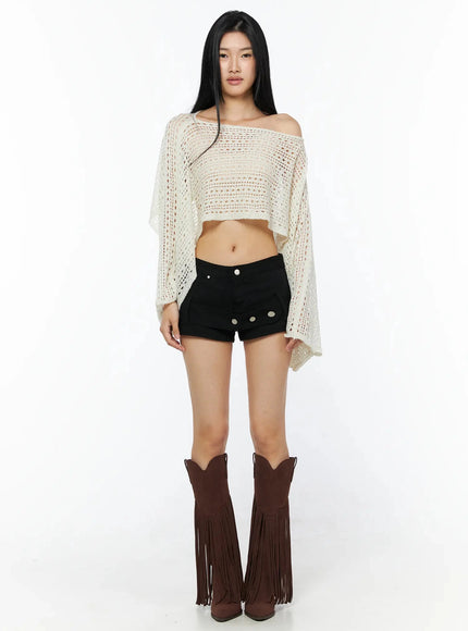 Shawl Crop Knit Top IL506 Light beige full-length front model straight-on pose showing open-knit shawl silhouette with brown fringe cowboy boots and black shorts