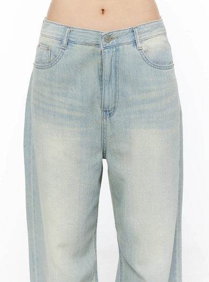 Shawn Washed Wide Leg Jeans CL501 Light blue close-up detail shot showing front waistband V-notch button coin pocket and sun-faded wash texture