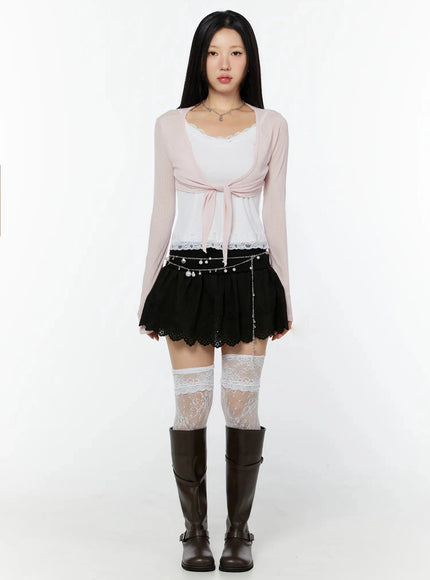 Sheer Front-Tie Wrap Cardigan IU524 Pink full-body front shot on model standing straight, sheer ribbed knit with front-tie closure over white lace tank