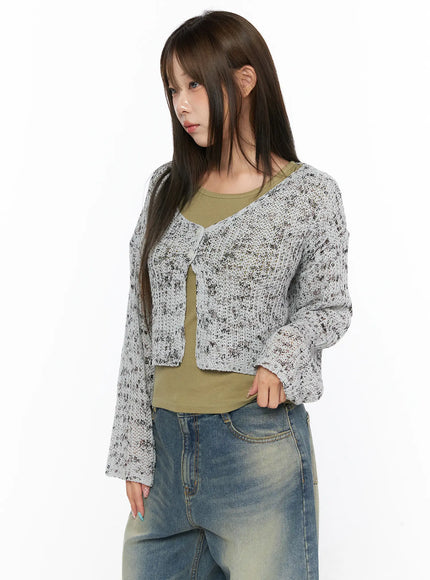 Sheer Knit Cardigan CL517 Gray angled front shot on model showing open neckline, loose semi-sheer speckled knit layered over olive tank and jeans
