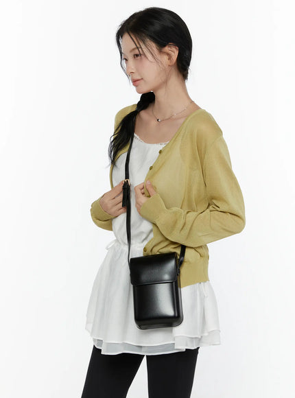 Sheer Knit Cropped Cardigan CL520 Yellow-green side shot on model styled with white layered dress black leggings and black crossbody bag