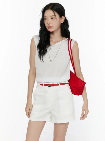 LEWKIN Sheer Knit Sleeveless Top CL521 White S/M front three-quarter shot on model looking sideways styled with white shorts red belt and red bag