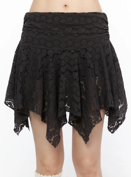 Sheer Lace Asymmetric Mini Skirt CL523 Dark brown close-up front shot on model highlighting ruched waistband and handkerchief asymmetric lace hem detail
