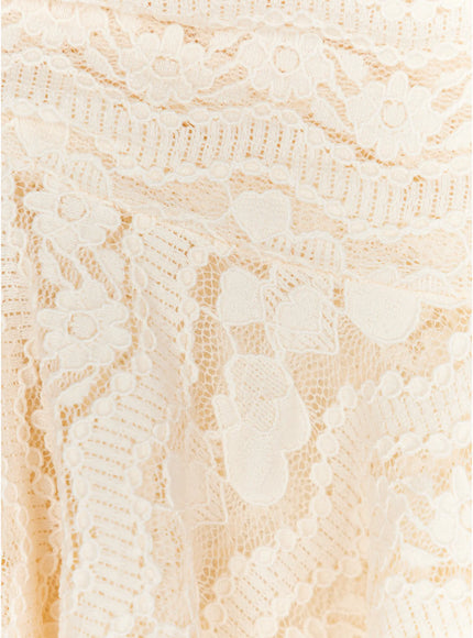 Sheer Lace Asymmetric Mini Skirt CL523 close-up detail of ivory floral lace fabric showing semi-sheer mesh weave and embroidered flower pattern texture