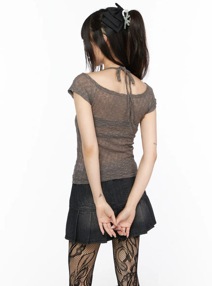 Sheer Lace Halter Off-Shoulder Tee CL522 Dark beige back close-up on model upper body showing halter tie knot at neck sheer lace weave texture and raw hem detail