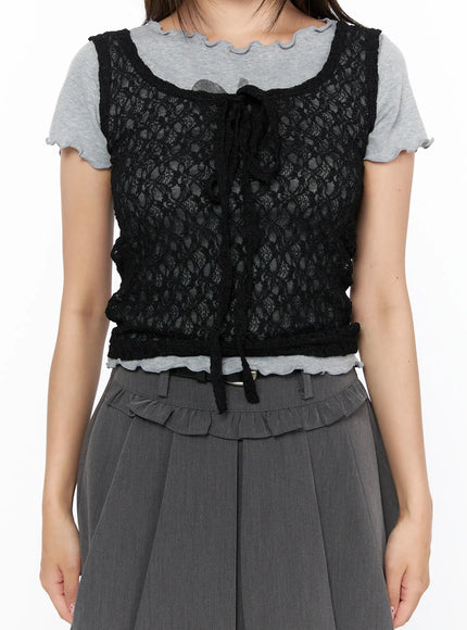 Sheer Lace Ribbon Tank Top CL514 Black close-up detail shot on model showing floral sheer lace fabric ribbon tie neckline boucle trim hem layered over gray lettuce-edge tee