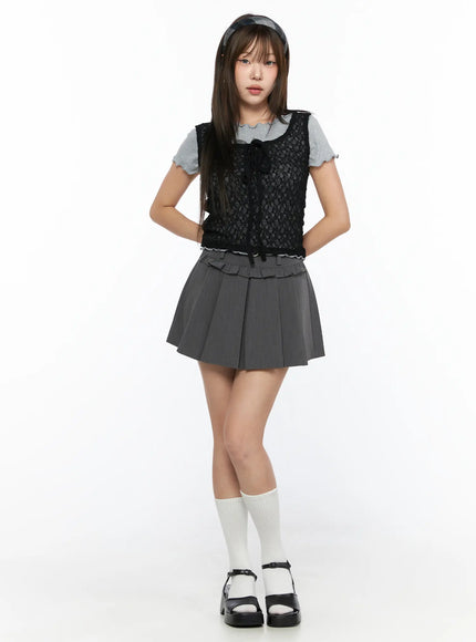 Sheer Lace Ribbon Tank Top CL514 Black front full-body shot on model standing straight hands behind back layered over gray tee with gray ruffle-waist pleated mini skirt white socks