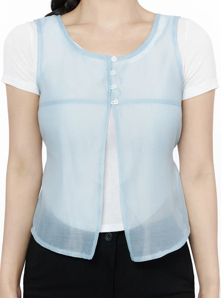 Sheer Layered Blouse IU525 Light blue three-quarter front model shot, model holding braid, open-front sheer vest with button detail over white tee and black pants