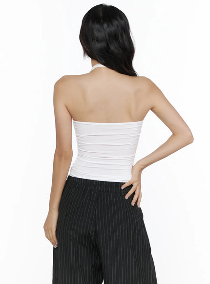 Sheer Layered Halter Top CL513 White back model shot showing open back, halter tie at nape, horizontal ruched texture, paired with black pinstripe wide-leg trousers
