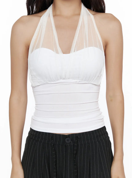 Sheer Layered Halter Top CL513 Black front model shot with sheer mesh halter neck, ruched corset bodice, chain necklace, styled with black pinstripe trousers