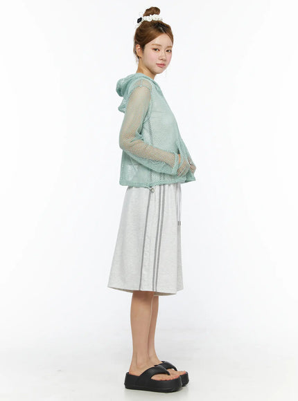 Sheer Mesh Hoodie CL501 Mint side model shot sheer mint mesh hoodie with hood model looking back paired with wide-leg grey midi shorts