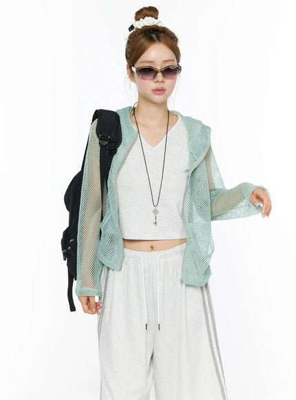 LEWKIN Sheer Mesh Hoodie CL501 Mint S/M front model shot open zip sheer mint mesh hoodie styled with white crop top and wide-leg pants black backpack