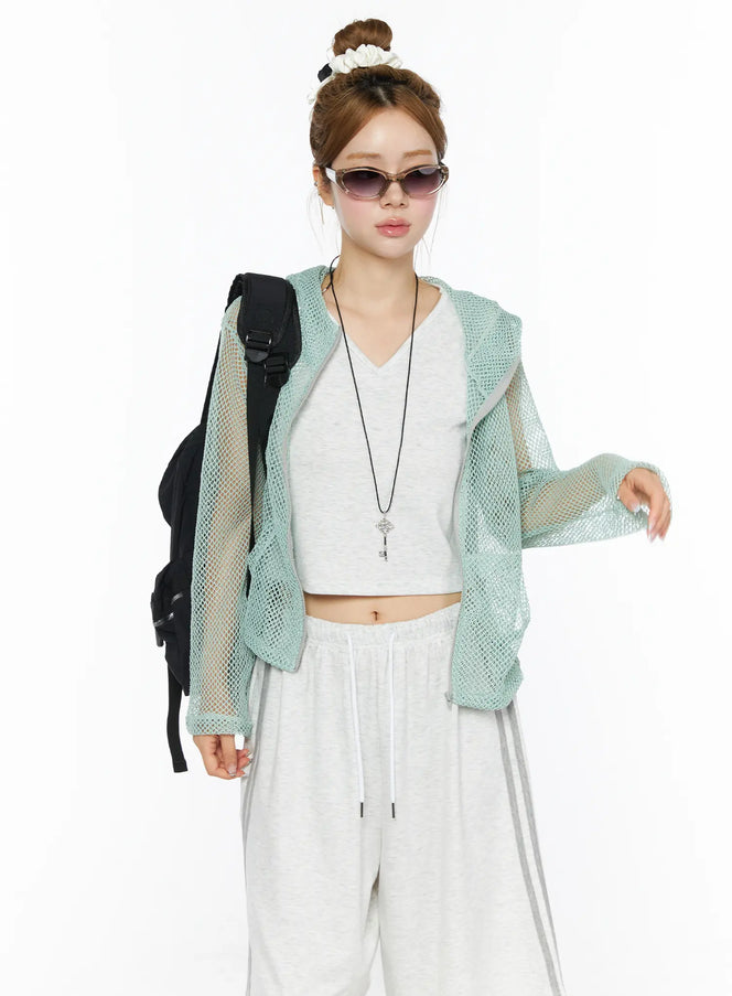LEWKIN Sheer Mesh Hoodie CL501 Mint S/M front model shot open zip sheer mint mesh hoodie styled with white crop top and wide-leg pants black backpack