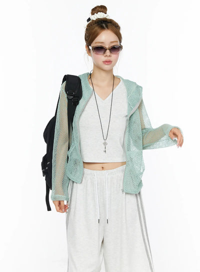LEWKIN Sheer Mesh Hoodie CL501 Mint S/M front model shot open zip sheer mint mesh hoodie styled with white crop top and wide-leg pants black backpack