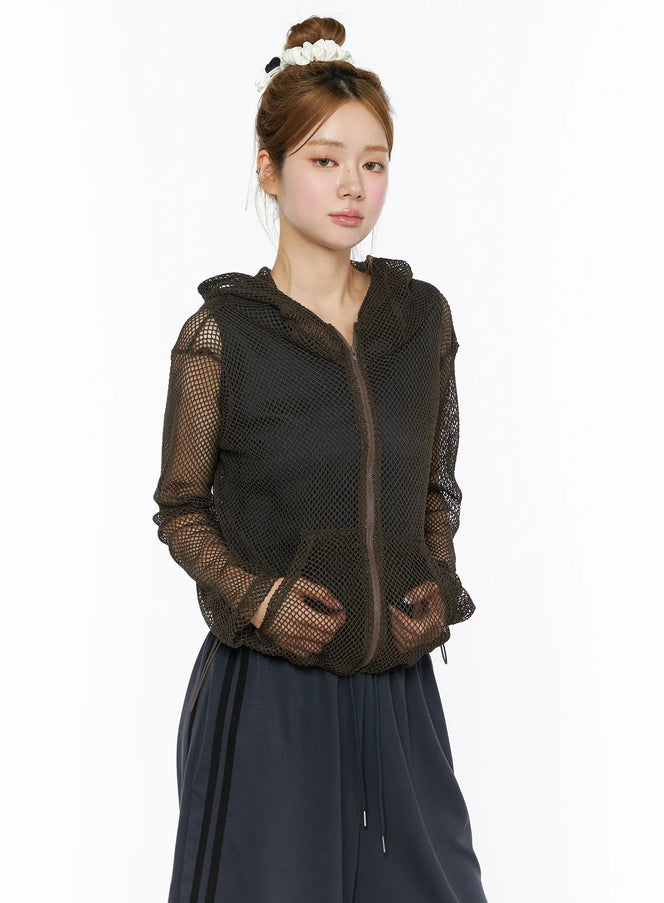 Sheer Mesh Hoodie CL501 dark brown side-angle model shot zip-up sheer mesh hoodie with hood paired with navy drawstring skirt