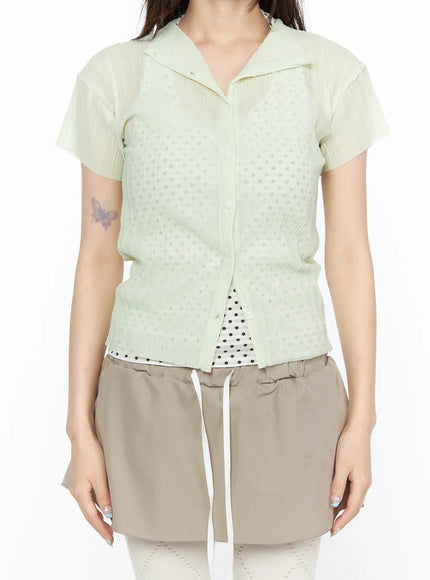 Sheer Pleated Short Sleeve Cardigan CL523 Light green close-up front detail view showing camp collar button placket dot-jacquard sheer body and pleated sleeves