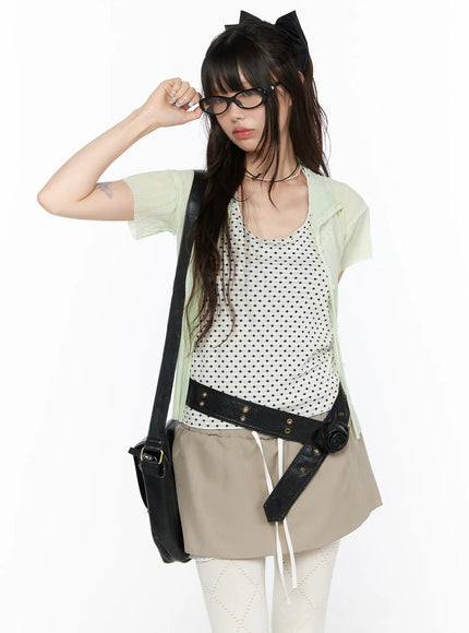 LEWKIN Sheer Pleated Short Sleeve Cardigan CL523 Light green cropped front view on model wearing open over polka dot top with black crossbody bag